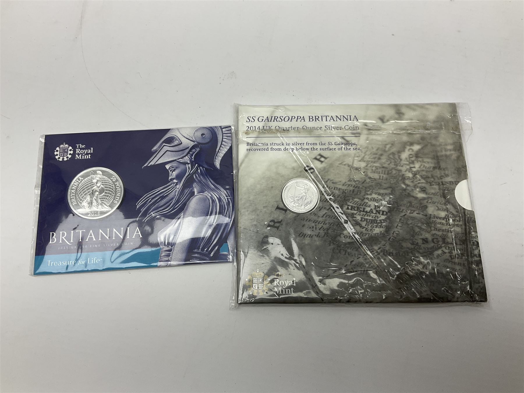 The Royal Mint United Kingdom 2014 'SS Gairsoppa Britannia' fine silver quarter ounce coin in card folder and 2015 'Britannia' fine silver fifty pound coin on card
