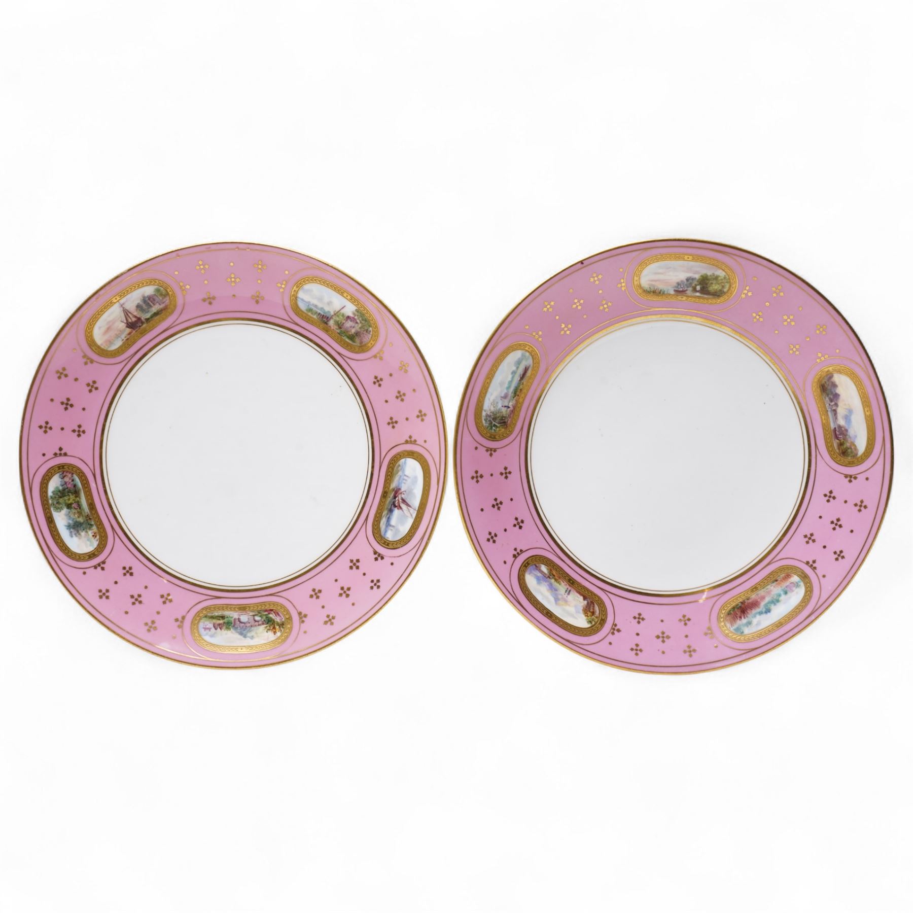 Pair of Victorian Minton plates, the pink borders painted with small landscape panels D24cm