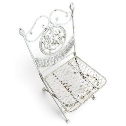 Three-piece French style white-painted wrought iron garden bistro set, comprising a circular folding table with latticework top and apron with scrolling foliate motifs (W70cm H80cm) and matching pair of chairs, with scrolling cresting rail and acorn finials over a scrolled foliate medallion, raised on lattice seat and folding X-frame base (W42cm H93cm)