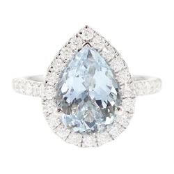 White gold aquamarine and diamond cluster ring, single pear cut aquamarine of approx 2.75 carat, surrounded by round brilliant cut diamonds and diamond set shoulders, hallmarked 9ct