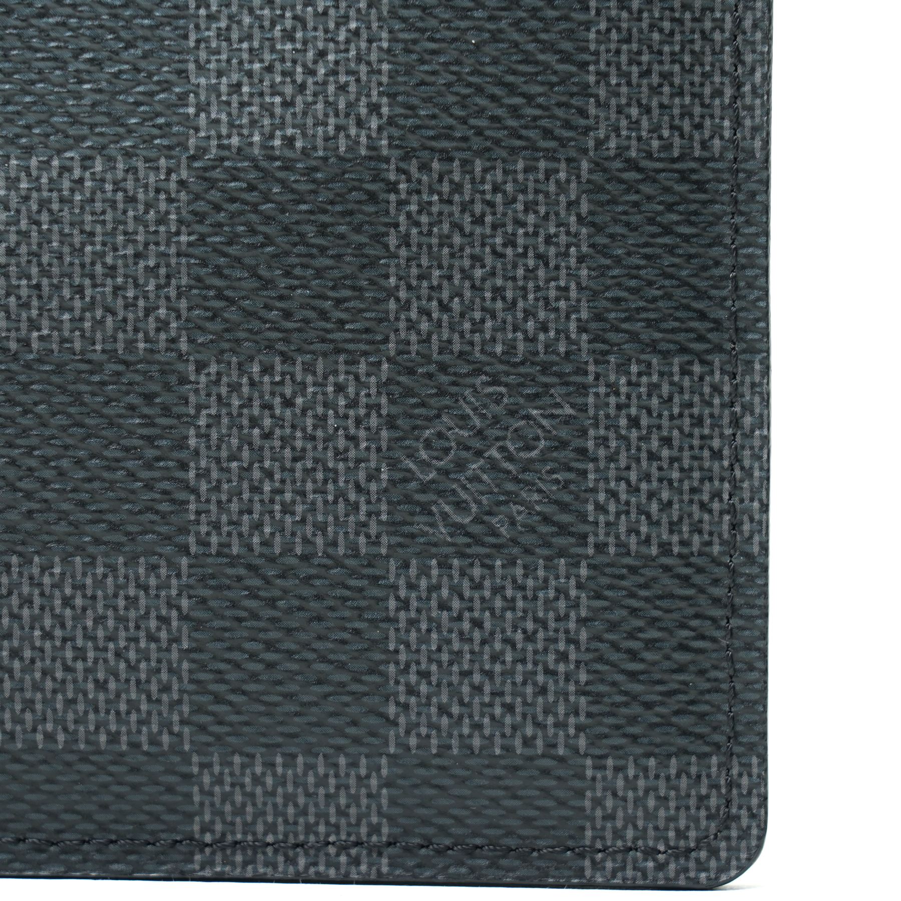 Louis Vuitton Damier Graphite canvas passport holder, the black and grey checkerboard exterior opening to a crossgrain leather interior with card slots and slip pockets, stamped Louis Vuitton Paris and made in Spain, together with original Louis Vuitton box and dust cloth