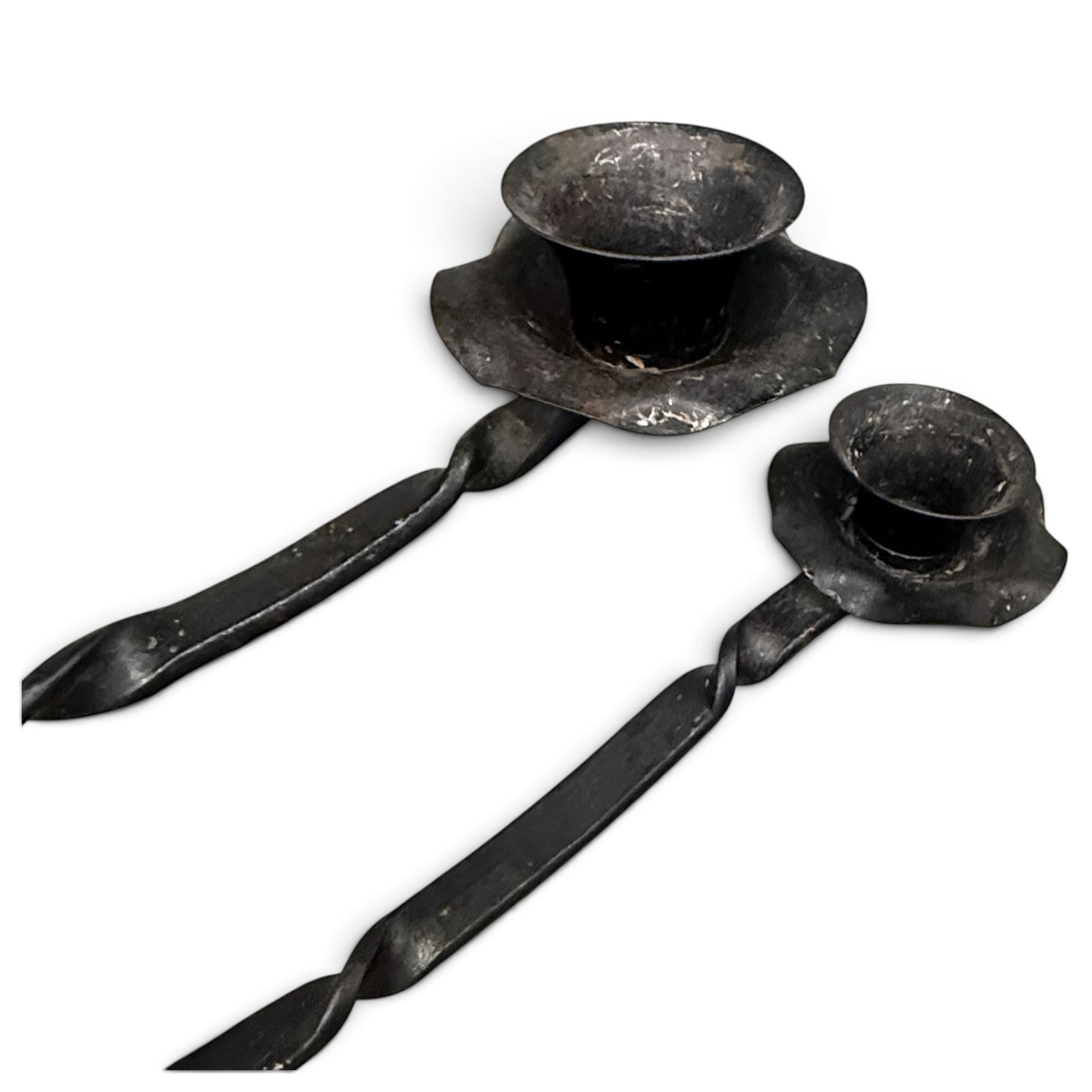 Collection of wrought iron candle stands, comprising five-light and three-light floor-standing candelabra with scrolling branches, and a pair of five-light table candelabra of naturalistic branching form
