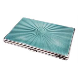 Late Art Deco silver and enamel cigarette case, with green guilloche enamelled front, engine turned detail verso, and gilt interior, hallmarked G & G, Birmingham 1938, H12.5cm, approximate gross weight 7.75 ozt (241.1 grams)