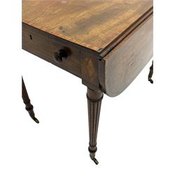 George III mahogany Pembroke table, drop-leaf oval top with satinwood band, fitted with single end drawer, inlaid with satinwood lozenge motifs, on turned and reeded supports with brass cups and castors