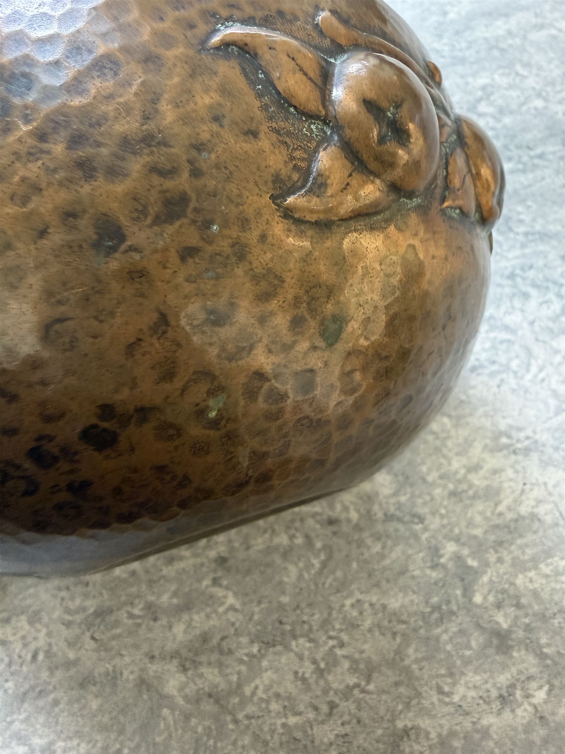 Newlyn school Arts and Crafts copper rose bowl, the planished exterior with fruit and leaves in high relief, H8.5cm x W18cm