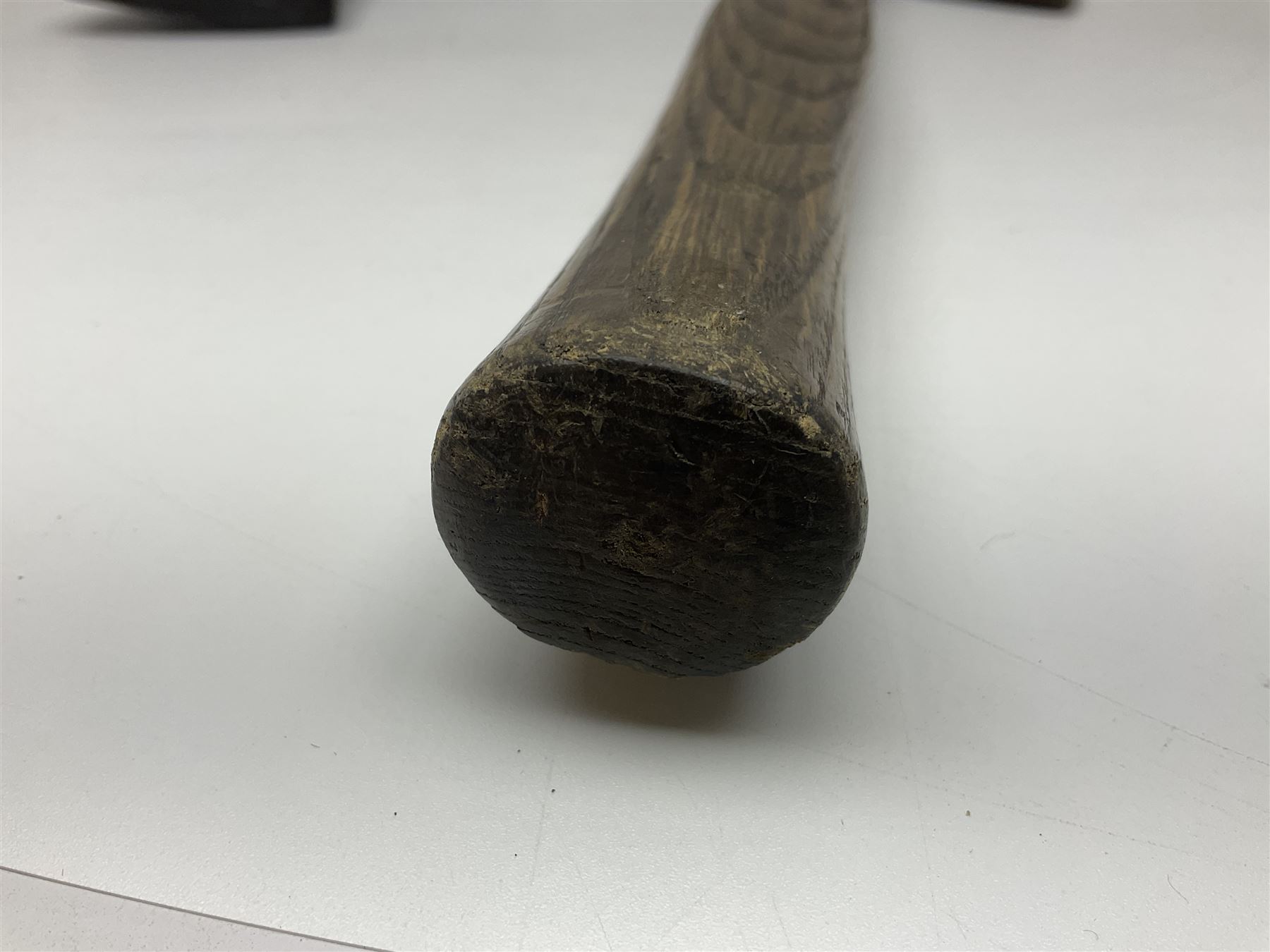 Post-War military type fireman's axe impressed 'PERKS 1953/54' with additional indistinct mark probably WD arrow, ash handle L39cm; and another stonemason's(?) double headed axe with mallet shaped shaft (2)