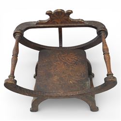 Late 19th century Savonarola style oak chair, X-frame construction with carved and shaped cresting rail, the curved arms with chip carved decoration, turned horizontal supports, solid dished seat with adzed surface, raised on shaped splayed feet