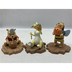 Collection of eight Disney Pooh and Friends figures, comprising Hip, hip Poohray for birthdays, Tricks and treats for someone sweet, We'll share forever whatever the weather, Thanks for being a Caring Sort of Bear, Now it's perfect just like you, Have a red-shirt red letter day, Life is sweet and I love you Mama, all with boxes