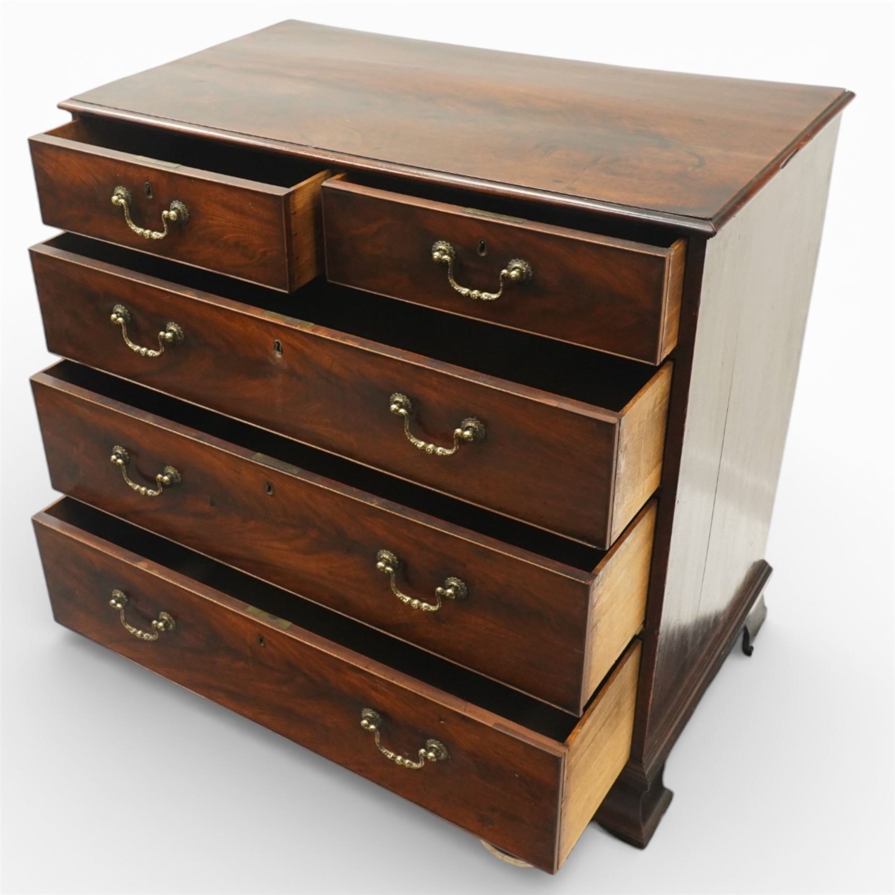 18th century Chippendale style mahogany chest of drawers, the moulded rectangular top above two short and three long drawers fitted with brass swan neck handles, raised upon original shaped bracket feet