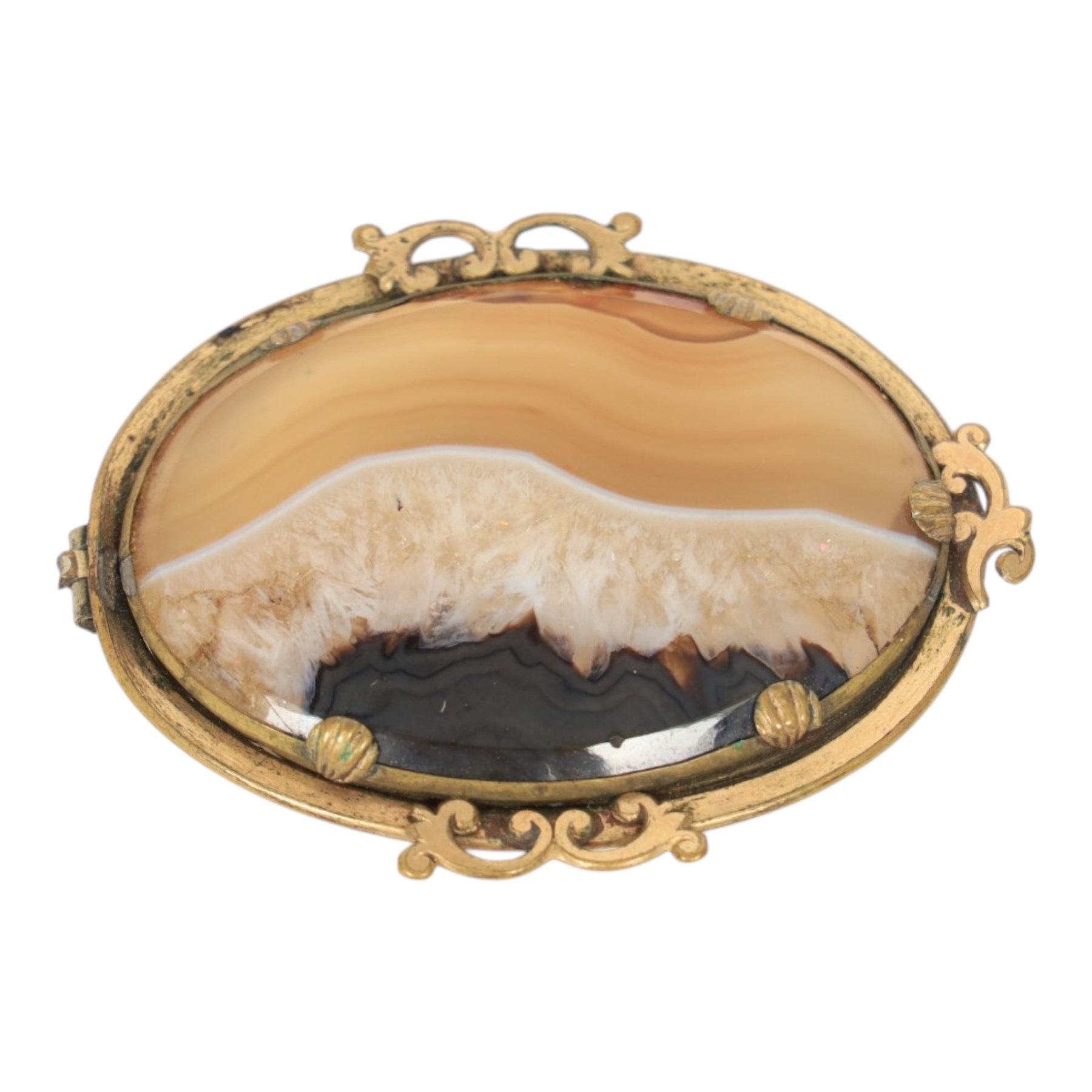 Six brooches, including one Ruskin example in silver mount, four Ruskin style brooches with ceramic roundels and a plated agate example