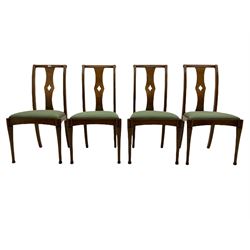 Set of eight contemporary walnut dining chairs, curved backs set with shaped splats with pierced detail, drop in upholstered seat cushions, on turned supports 