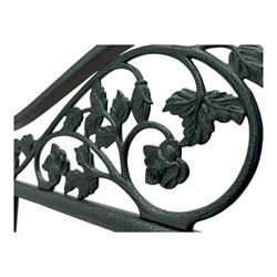 Contemporary metal double bed frame, shaped head and footboards with foliate cast panels and vertical rod supports, the corner posts with urn-shaped finials, finished in a mottled verdigris-style green, with pine slatted base