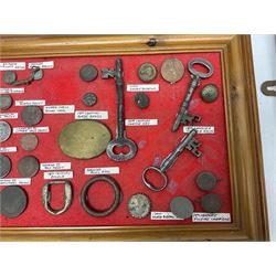 Collection of metal detecting finds and antiquities, housed on five display boards and some loose, to include coins, keys, axe head etc 