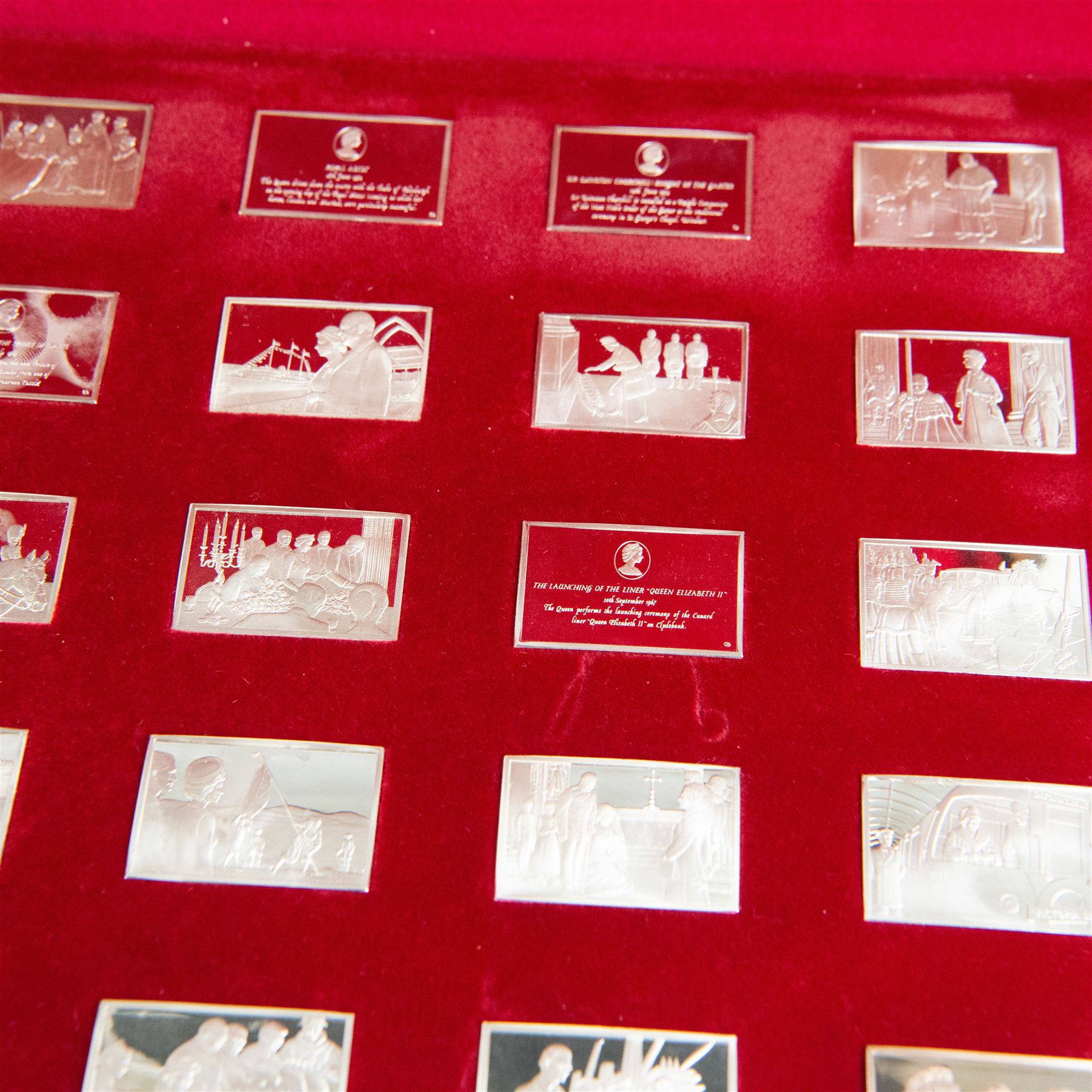 Elizabeth Our Queen silver ingots collection, twenty-five rectangular ingots each decorated in relief with a Royal scene, hallmarked John Pinches Ltd, London 1976, in wooden presentation case with information booklet