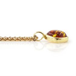 14ct gold Baltic amber pendant on gold cable link chain necklace and a pair gold Baltic amber screw back earrings within a rope twist surround, both 9ct