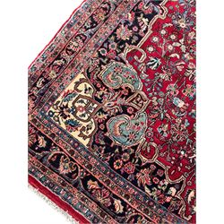 North West Persian Bidjar red ground carpet, shaped pole medallion surrounded by interlacing branches and stylised flower heads, five band border with repeating floral design