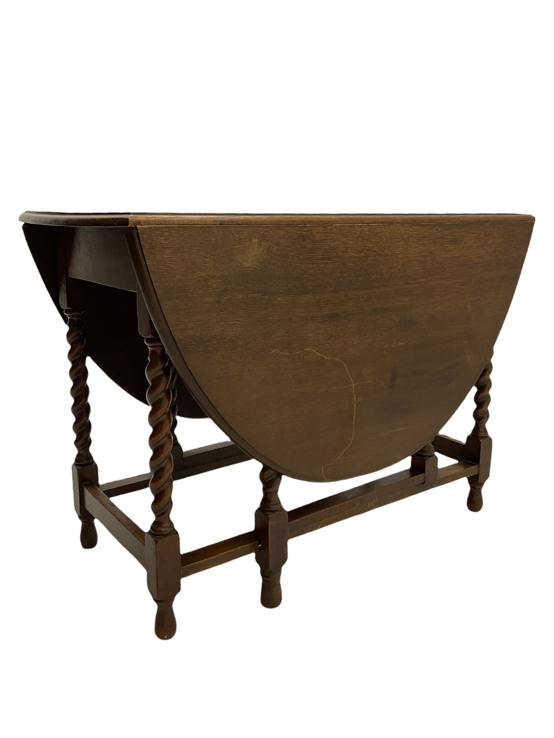 Early 20th century oak barley twist drop leaf dining table (105cm x 154cm, H74cm), and four chairs 