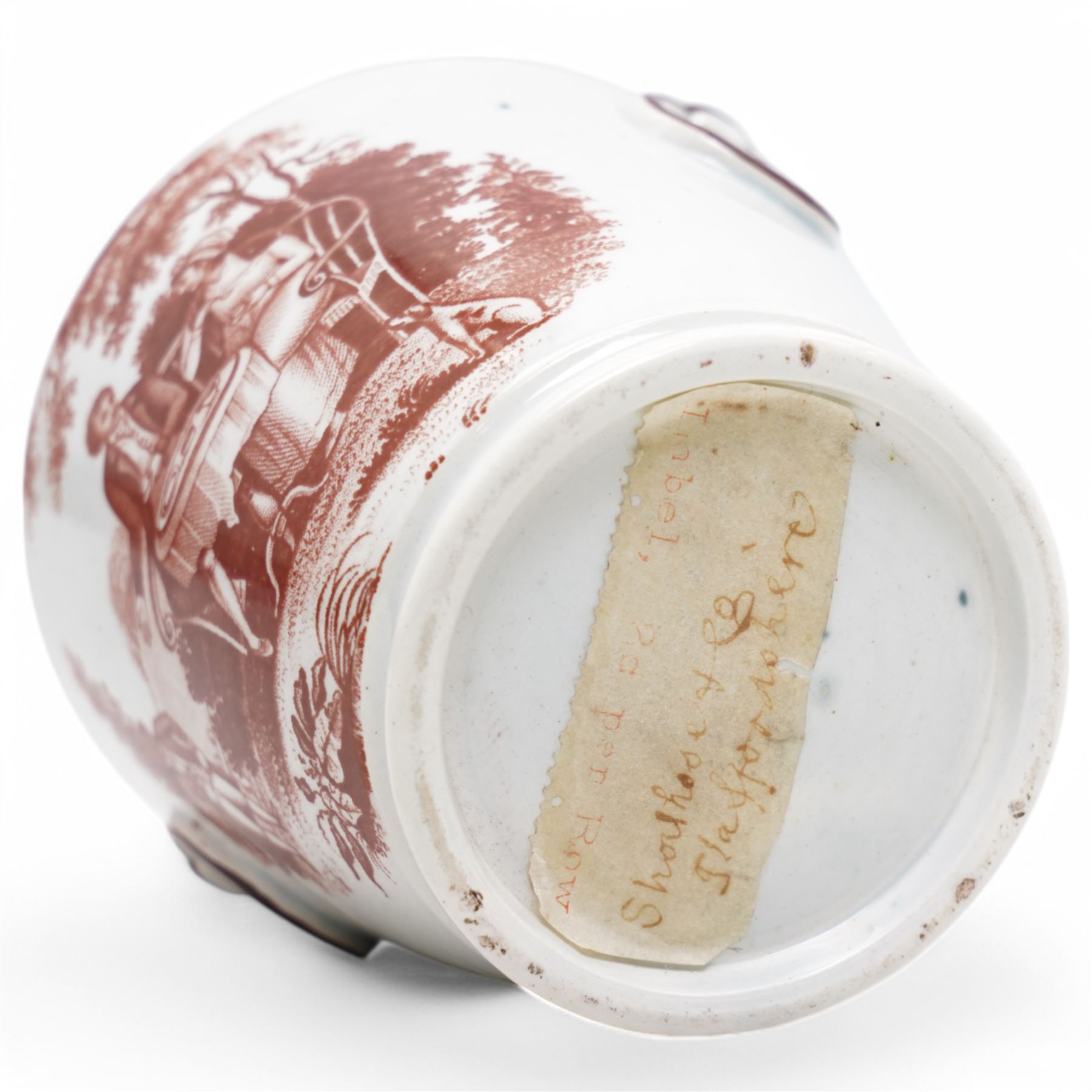 Early 19th century cream pail and cover printed in terracotta with figures sitting in a garden taking tea and with faux loop handles, with old label to the base 'Shorthose & Co. Staffordshire' H9cm