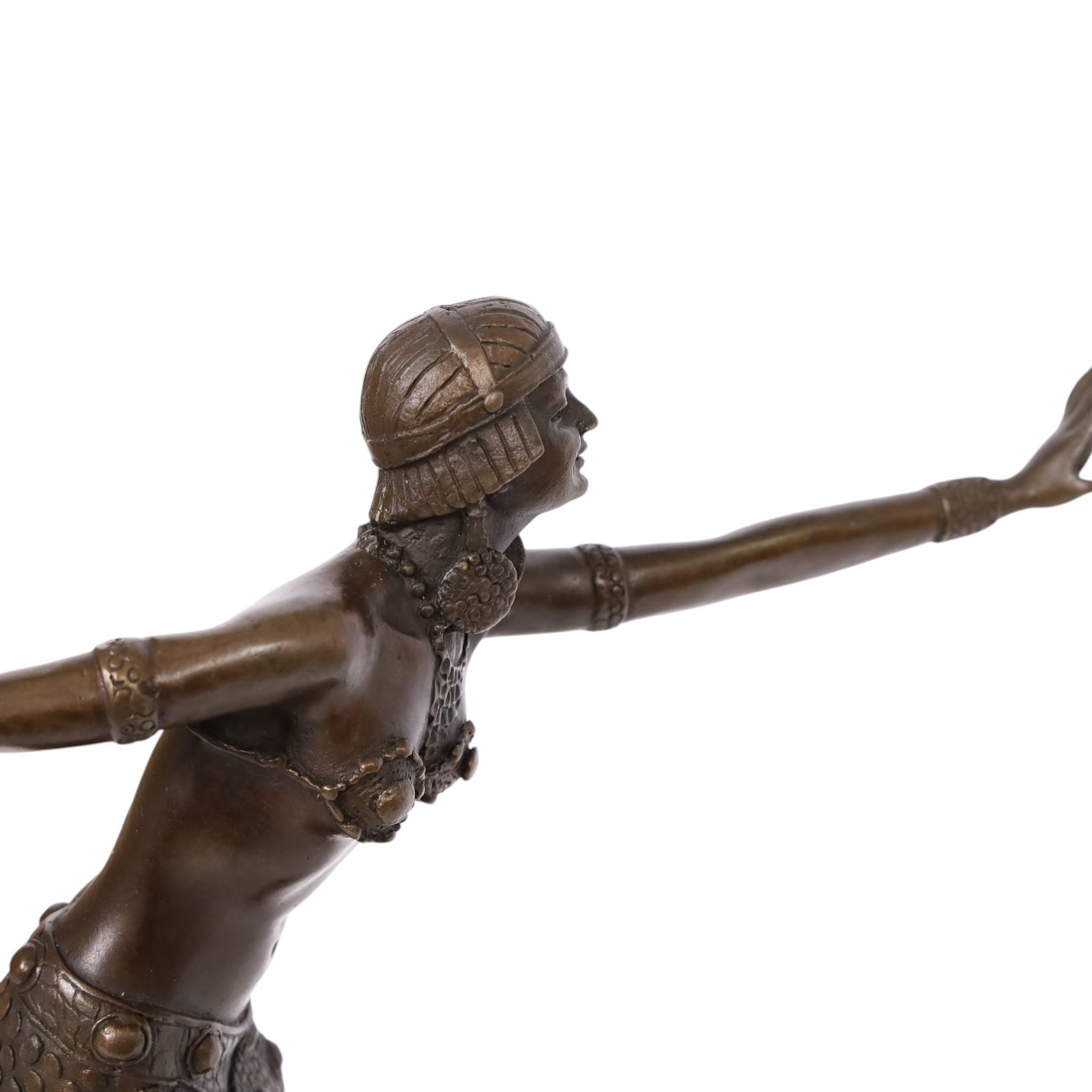 After Demétre Haralamb Chiparus (Romanian 1886-1947): Art Deco style bronze figure modelled as a dancer with outstretched arms, signed to the stepped bronze base and also bearing foundry stamp, upon a tapering marble plinth, overall H49cm
