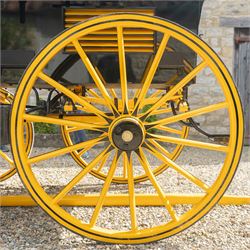 Roof Seat Break by Shanks of London

A roof seat break by Shanks of London built on a perch in black and yellow livery, the body fitted with an elevated driver's box seat, elevated rear groom's seat and central passenger compartment. The carriage is mounted on wooden spoked wheels with leaf spring suspension and is equipped with louvred underbody storage compartments, carriage lamp brackets (lamps next lot), folding access steps and a pole for driving with a pair or team of horses. The wheel hubs are stamped 