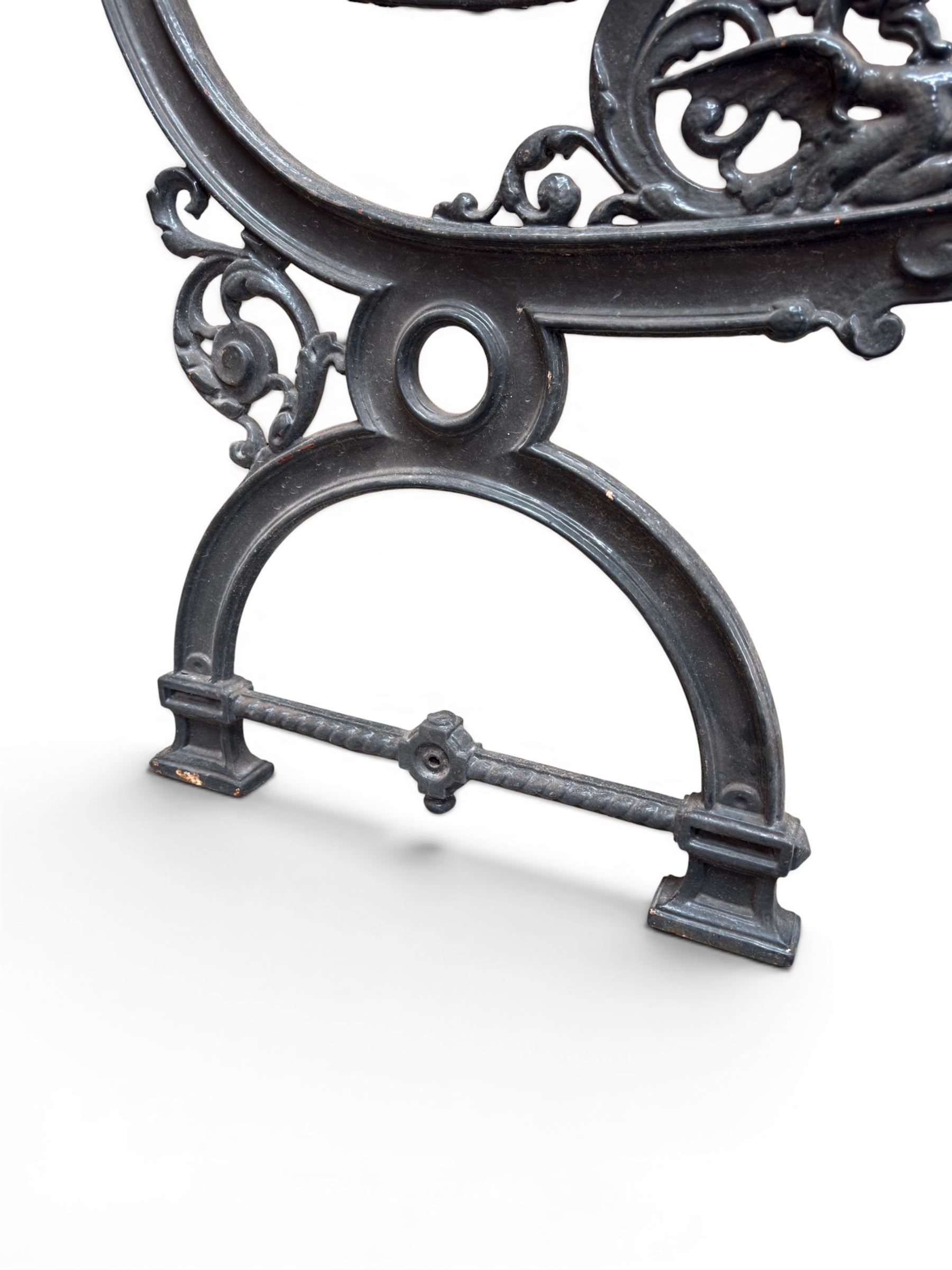 Yates Haywood - pair of 19th century cast iron bench ends, winged griffin detail, arched legs with rope turned decoration, finish in green paint, registration number 206550, first registered 8 March 1867 (see illustration), length as required