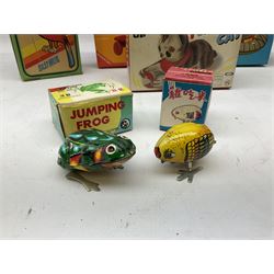 Seven modern Chinese, Japanese and Continental boxed tin-plate toys including Ucan Daire Flying Saucer, Drumming Animal, Circus Clown, Puzzle Cat, Bird with Jumping Action etc; and a quantity of clockwork toy keys (7)