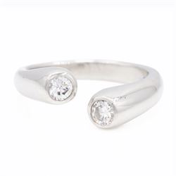 Platinum two stone diamond ring, the two bezel set finials set with a round brilliant cut ...