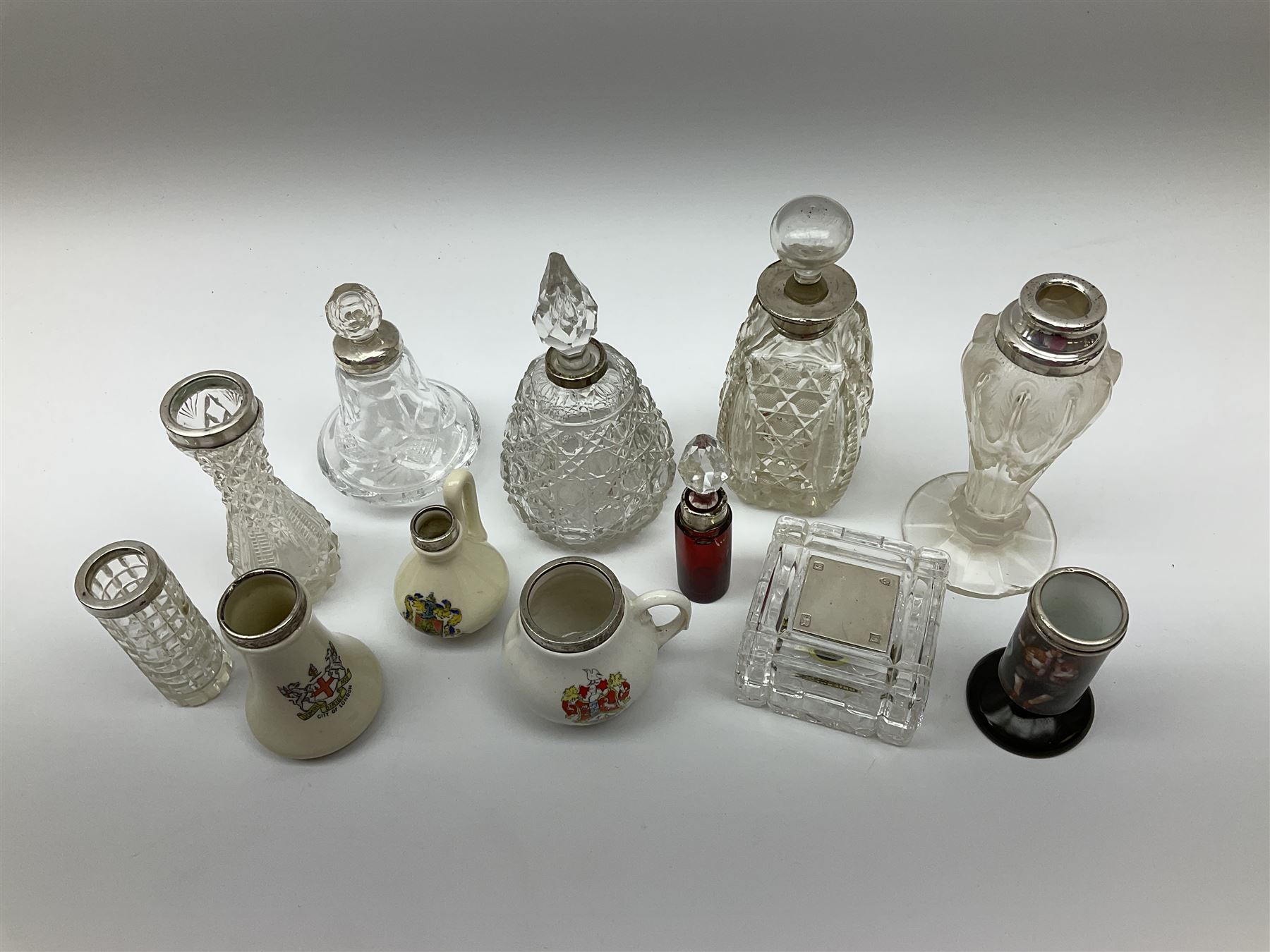 Group of silver mounted glass scent bottles and crested ware, together with a Brierglass lead crystal box with a glass and silver, lid, etc all silver with various hallmarks. 