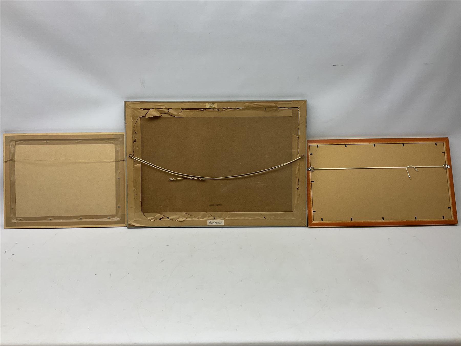 Hector Fraser (British 20th century): 'River Meadow', oil on board signed and dated 1973 together with two similar oils by different hands max 40cm x 60cm (3)