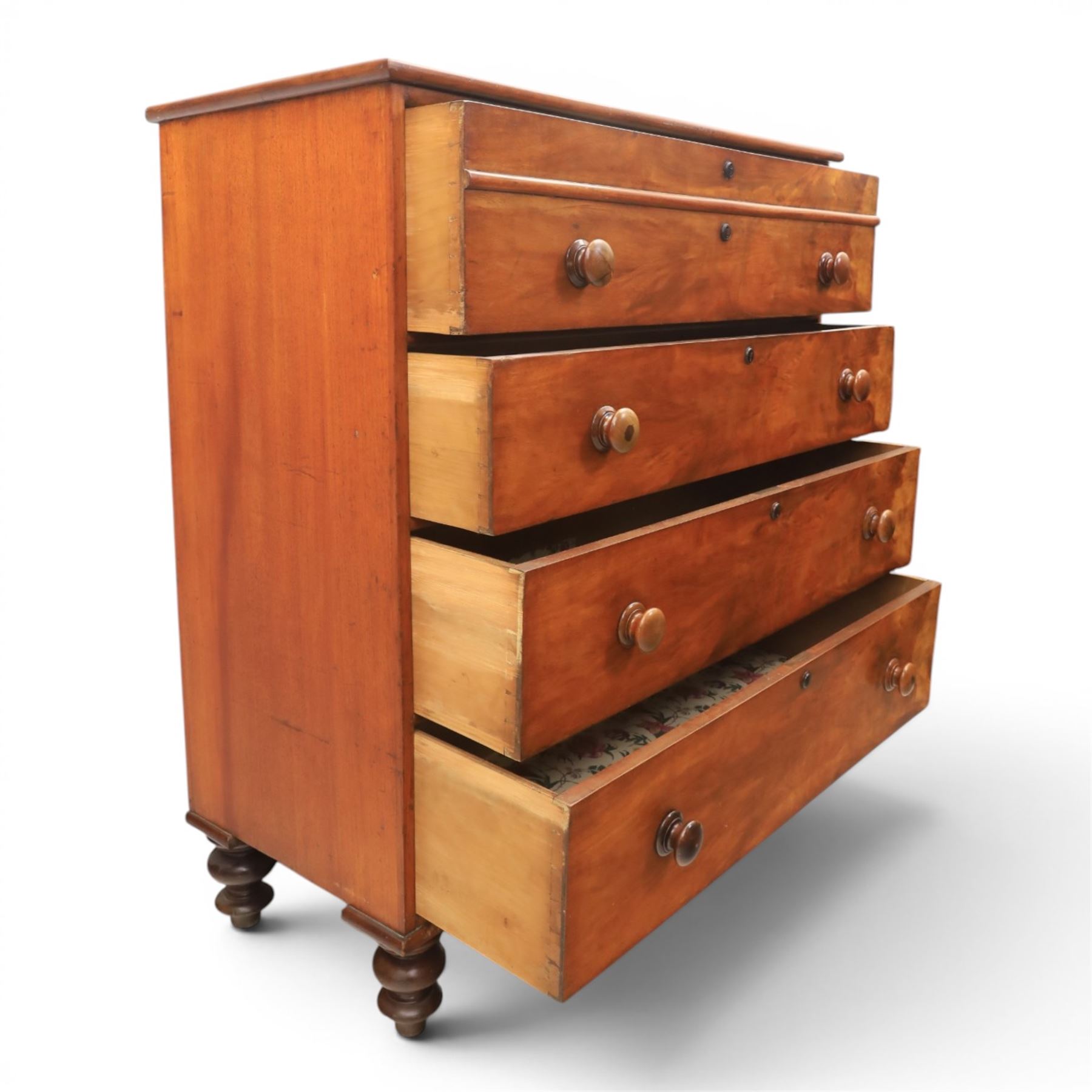 Victorian mahogany chest, with four long  flame mahogany fronted drawers with turned wooden knobs, raised on turned bun feet 