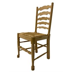 Three beech ladder back chairs with rush seats