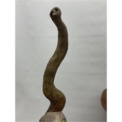 Helen Skelton (British 1933 – 2023): Three carved wooden abstract sculptures, each modelled as a cat, with carved or painted features, largest H63cm. Born into an RAF family in 1933 in Kent and travelled the world extensively during her childhood. After settling in Bridlington, Helen immersed herself in painting, textiles, and wood sculpture, often inspired by nature's beauty. Her talent was showcased in a one-woman show at Sewerby Hall and recognised with the sculpture prize at Ferens Art Gallery in 2000. Sadly, Helen’s daughter passed away from cancer in 2005. This loss inspired Helen to donate her sculptures to Marie Curie upon her passing in 2023.