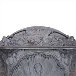 Art Nouveau cast iron fireplace, shaped hood with scrolling foliate crest, relief cast panel of female figure seated within shell form amidst wave motifs, uprights cast with foliate designs