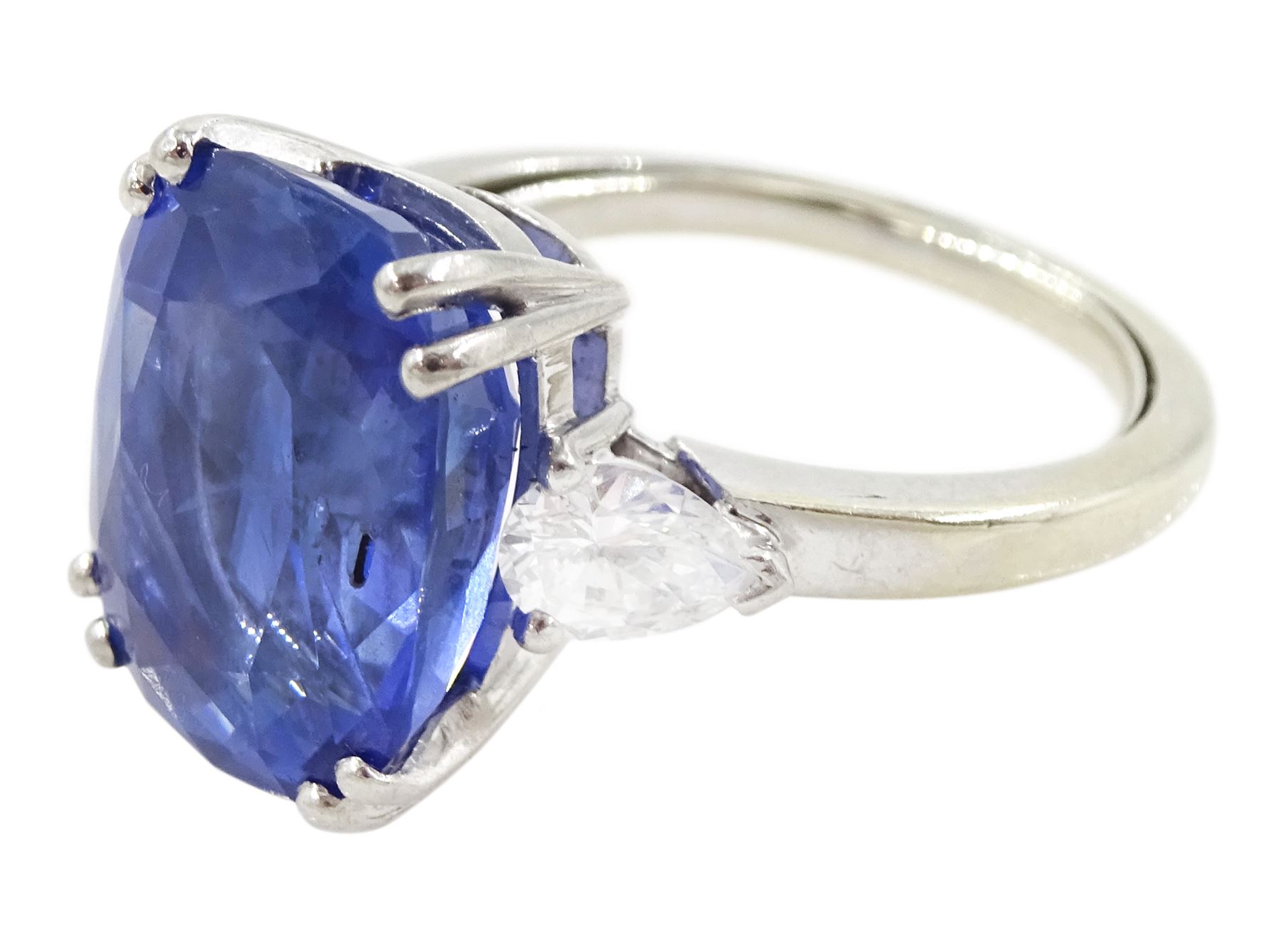 French 18ct white gold and platinum three stone unheated Ceylon sapphire and diamond ring, the single mixed cushion cut sapphire of 8.49 carat, with Gem Paris report, flanked by pear cut diamonds, hallmarked, total diamond weight approx 0.60 carat