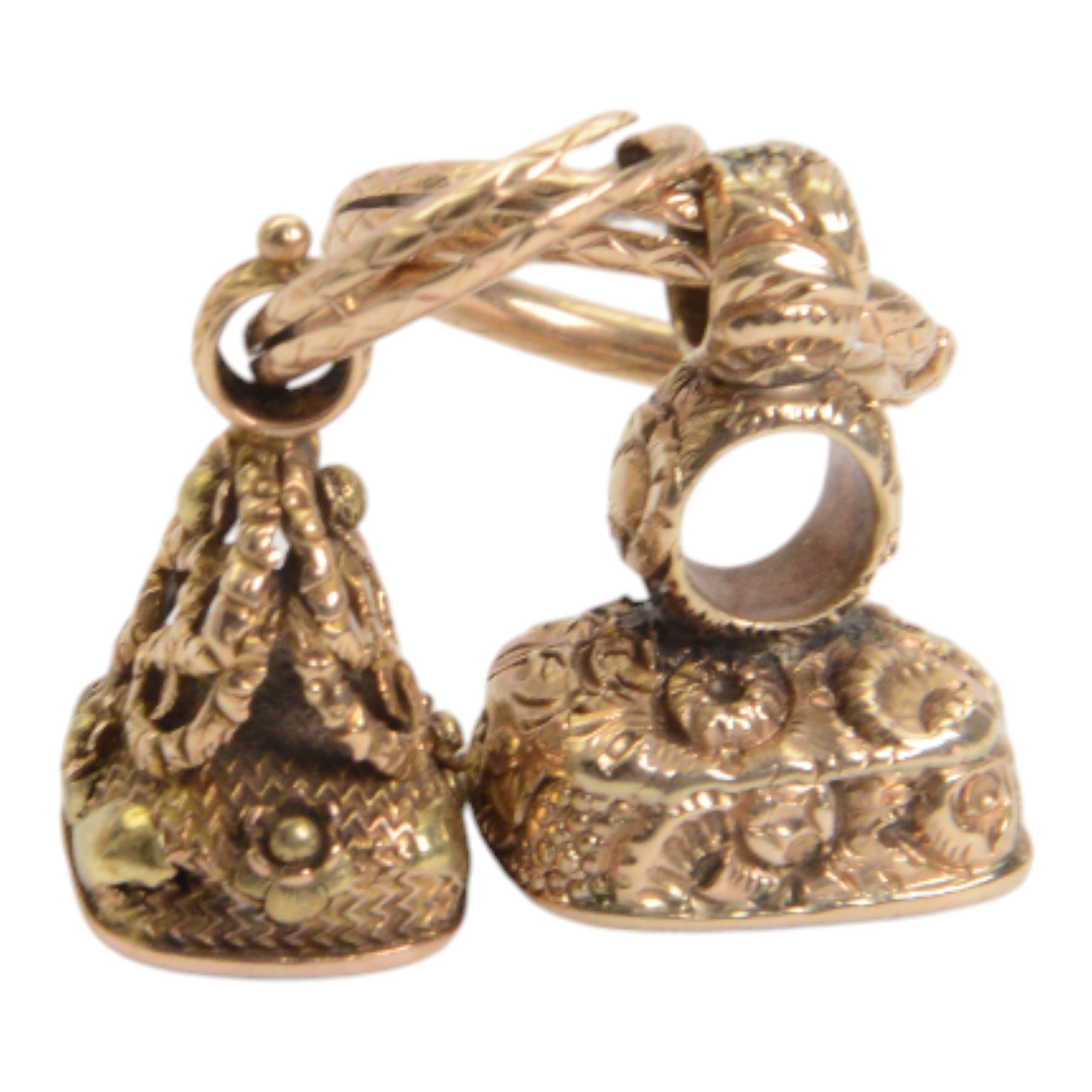 Two late 18th/early 19th century gold fob seals, the first 12ct example with amethyst matrix engraved with the letter D, the second 18ct example with bloodstone matrix, each within a foliate mount united by two 14ct ouroboros snake split rings, each seal approximately H2.5cm

Provenance: By family descent from the Chichesters of Arlington Court, Devon; from the collection of Andrew Chichester Everitt.