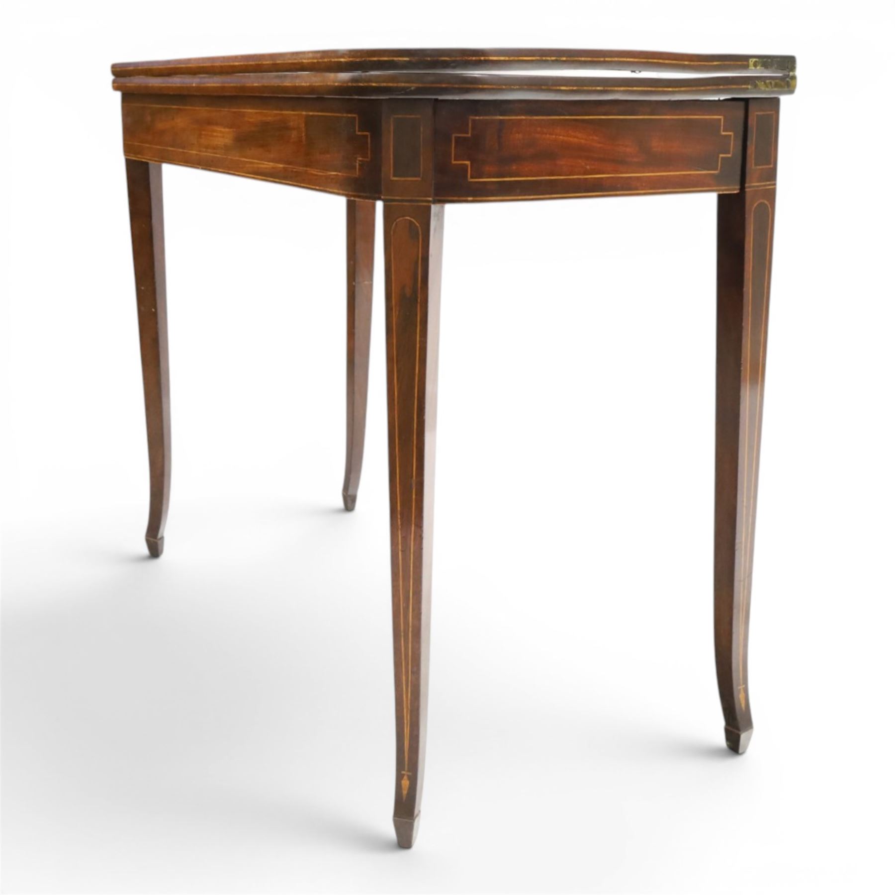George III mahogany tea-table, the D-shaped rectangular fold-over top with satinwood stringing, raised on elegant square tapering and splayed supports with spade feet and gate-leg action