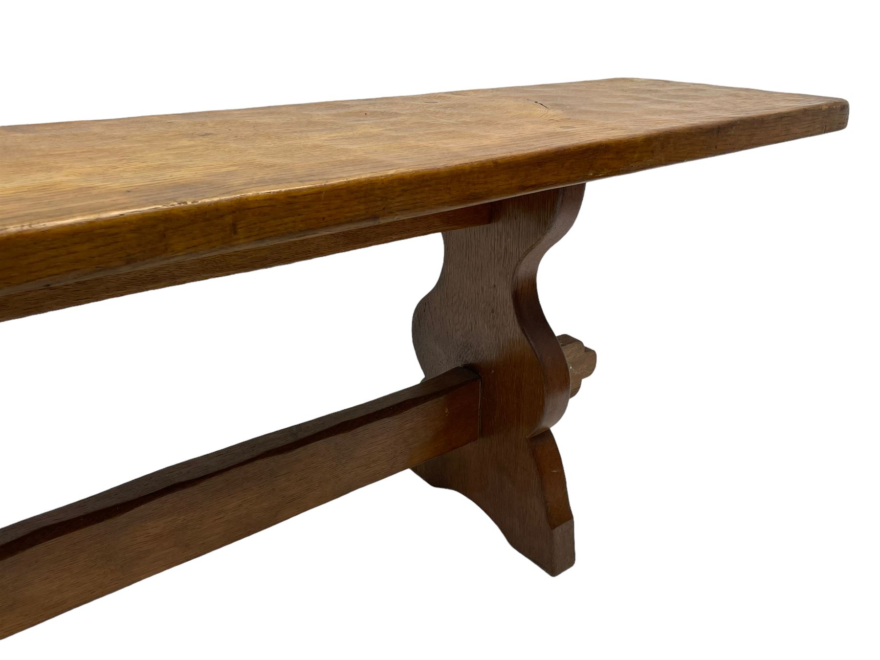 Gnomeman - adzed oak narrow bench, rectangular seat on shaped end supports united by pegged stretcher, carved with gnome signature, by Thomas Whittaker, Little Beck 