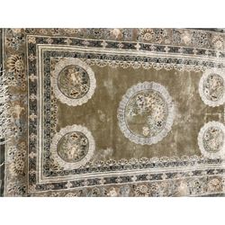 Three Chinese washed woollen rugs - circular blue ground decorated with dragons (D160cm), rectangular light green rug (185cm x 123cm), and a rectangular green rug (185cm x 123cm)