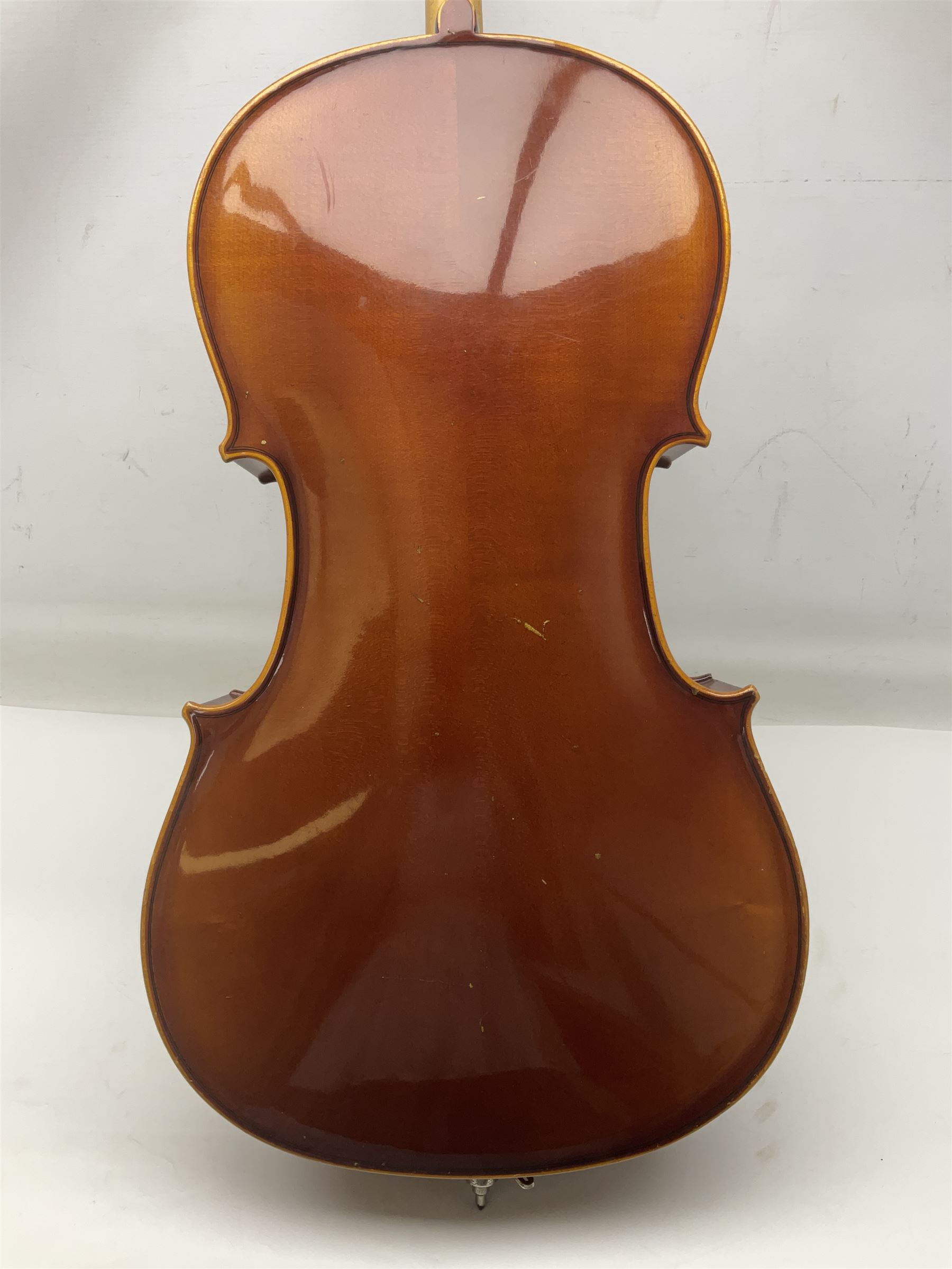 Two student half-size cellos - Boosey & Hawkes Artia with 65cm one-piece back and spruce top; bears maker's label; L104cm overall; and Romanian with 65.5cm two-piece maple back and ribs and spruce top; bears label; L108.5cm overall; each in soft carrying case with two bows (2)