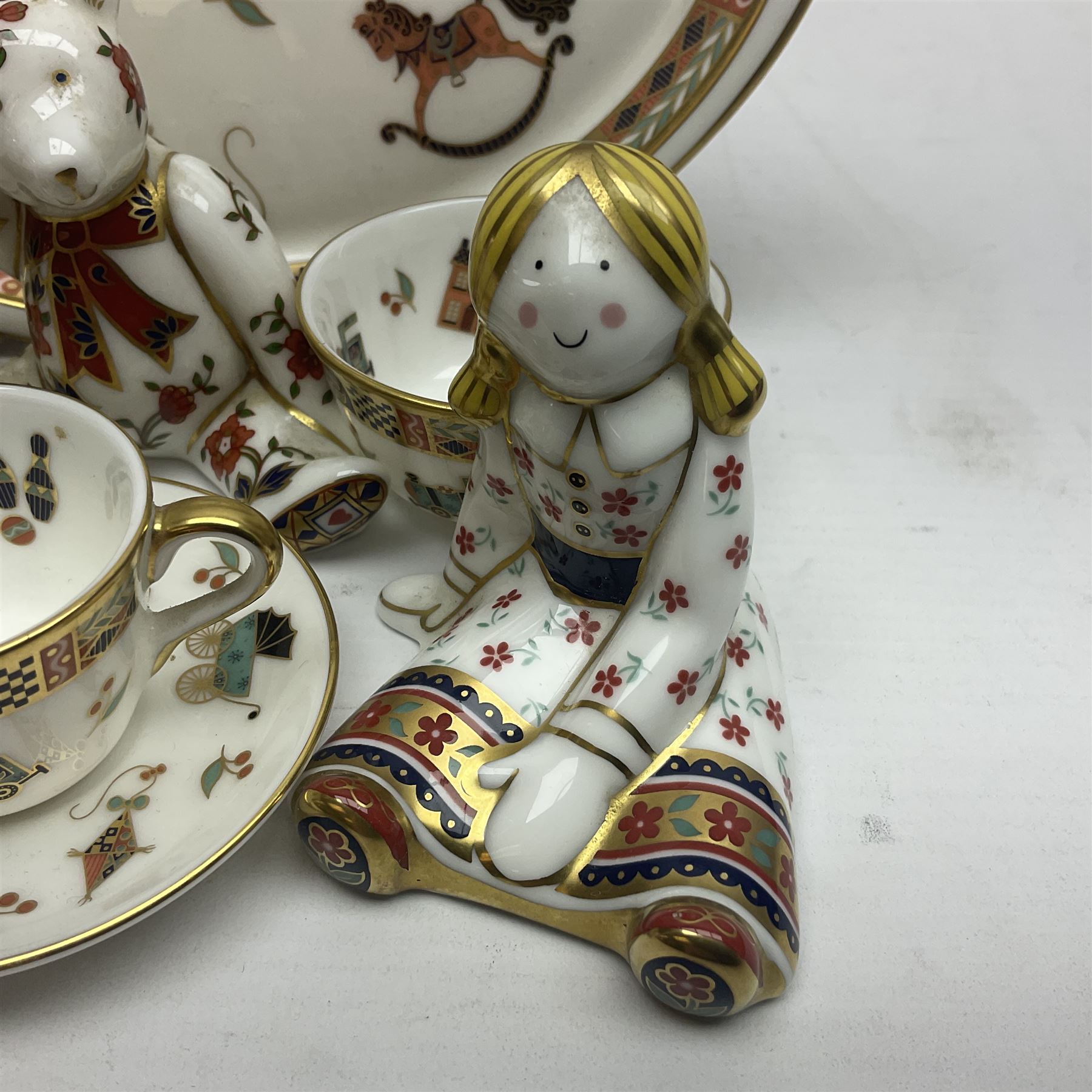 Royal Crown Derby Treasures of Childhood cabaret set, comprising tray, milk jug, sucrier, teacup and saucer, together with two Royal Crown Derby Treasures of Childhood paperweights Fleur and Ragdoll Sailor and Teddy bear paperweight, all paperweights are without stoppers