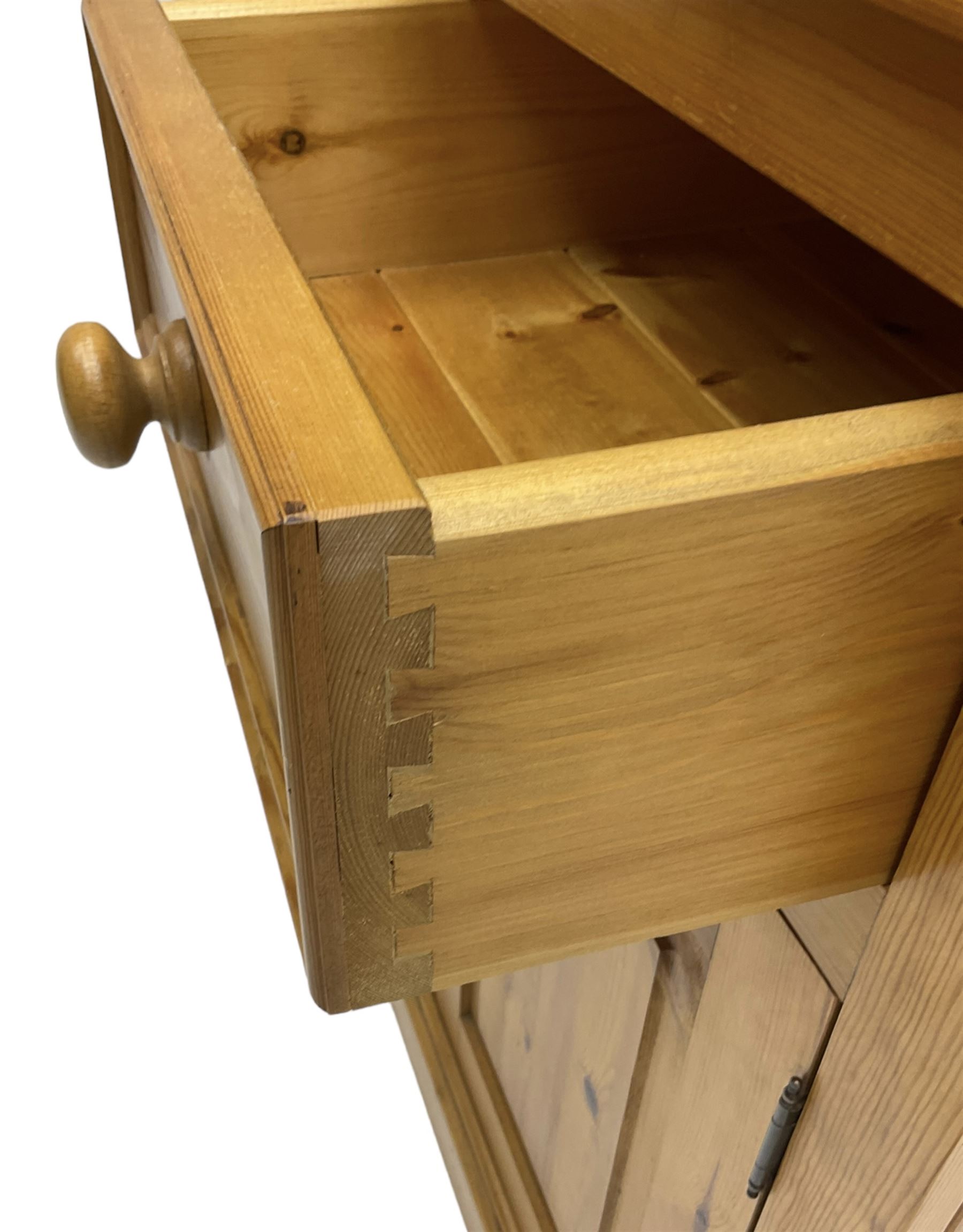 Traditional pine dresser, the rack fitted with two shelves flanked by glazed cupboards, the base with three drawers over three panelled cupboards