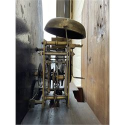 Thirty-hour oak cased longcase clock by  William Bancroft of Scarborough circa 1830, with a swan’s neck pediment, brass patera and three brass spire and ball finials, stepped break arch hood door flanked by plain pillars with brass capitals, trunk with a full length door and curved arch top, on a plain square plinth with bracket feet, painted break arch dial with roman numerals and quarter hour Arabic’s, date recorder (anti clockwise) and matching brass hands, arch painted with a rural scene depicting a ruined tower and cottage with depictions of flowers to the spandrels, dial pinned directly to a chain driven countwheel striking movement, striking the hours on a bell. With weight and pendulum. The Bancroft family were prodigious Scarborough clockmakers during the 18th and 19th century, William Bancroft is recorded as working in Newborough Street from 1820 onwards. 


