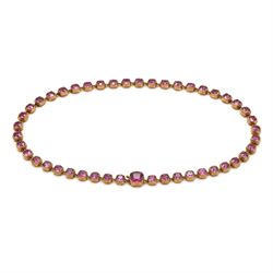 19th century gold garnet rivière necklace, set with forty-four graduating cushion cut rhod...