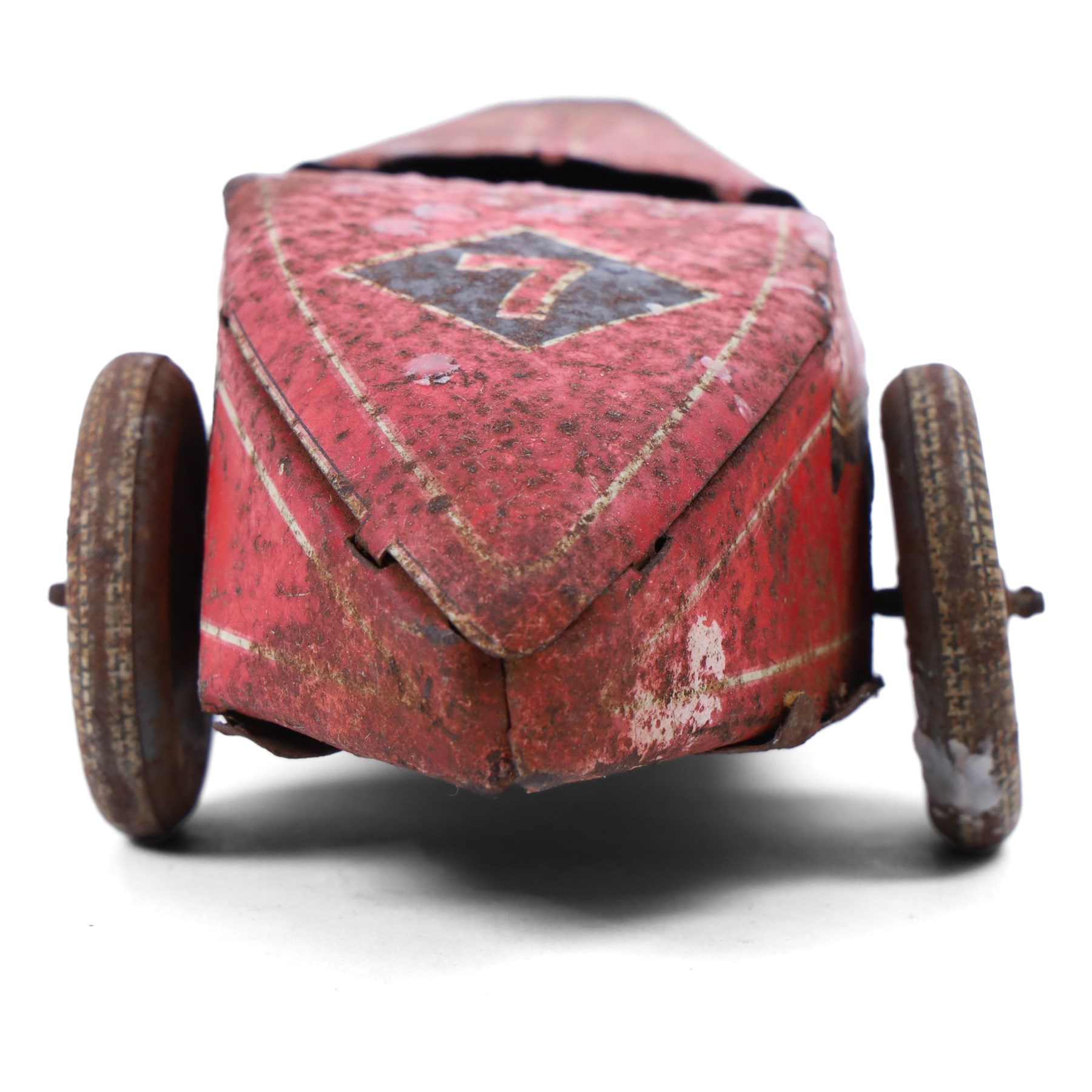 Mettoy tinplate clockwork racing car, the boat tailed red body with lithographed details, racing no. 7, with Dunlop Fort tyres, for restoration, H8cm, L32cm