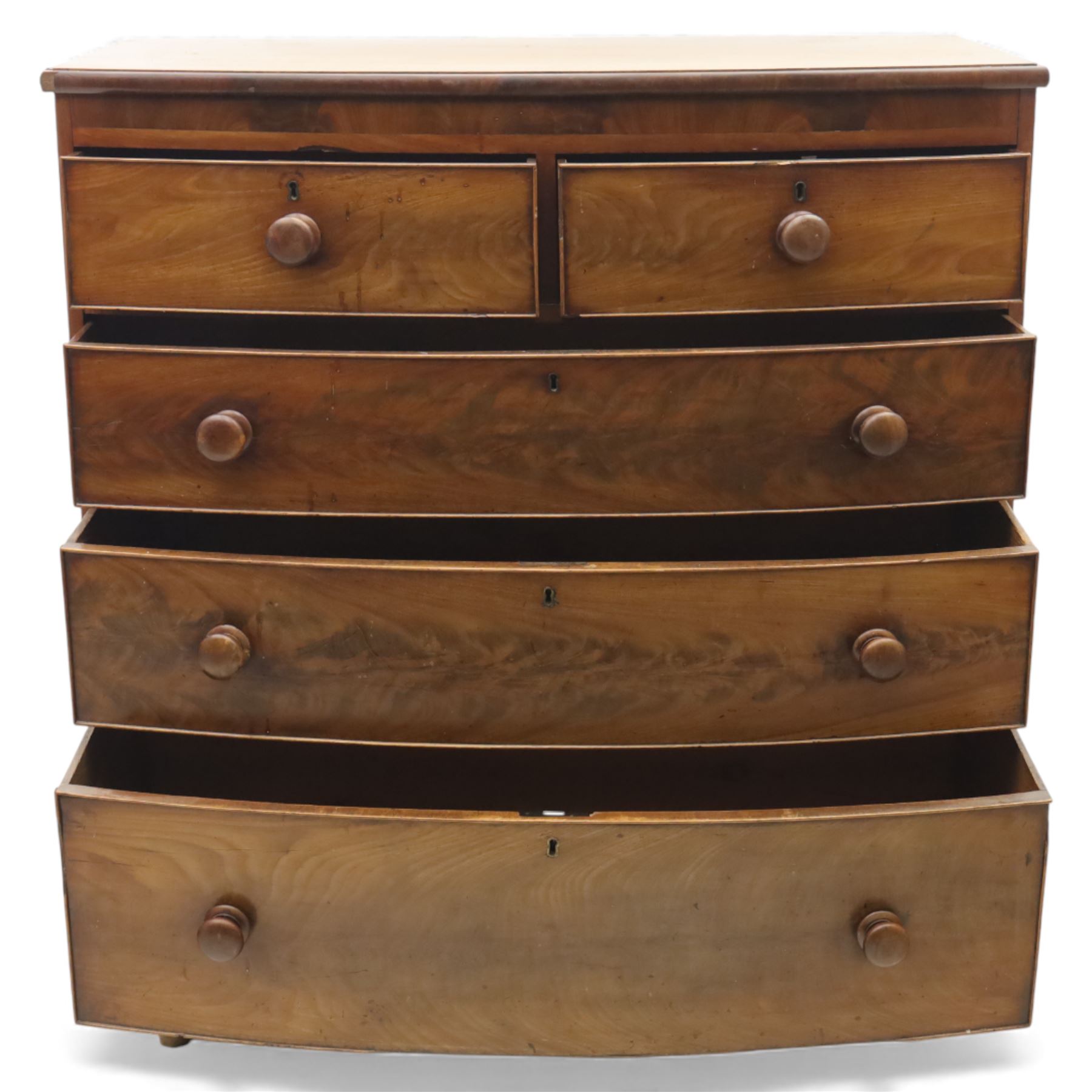19th century mahogany bow-front chest, with two short over three long graduated drawers, fitted with turned wooden knobs, raised on turned bun feet