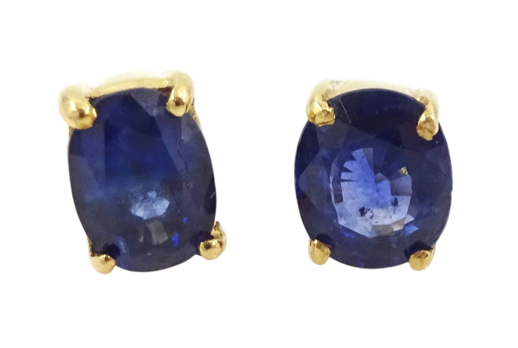 Pair of 18ct gold sapphire earrings, each stud set with a single oval cut sapphire, total sapphire weight approx 0.60 carat