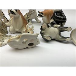 A collection of Russian animal figures, largely comprising Lomonosov examples, to include examples modelled as tigers, zebra, pandas, brown bears, giraffe, and racoons. 