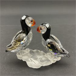 Three Swarovski Crystal bird figures, comprising Toucan, pair of puffins and pair of parrots on a branch, tallest H10cm