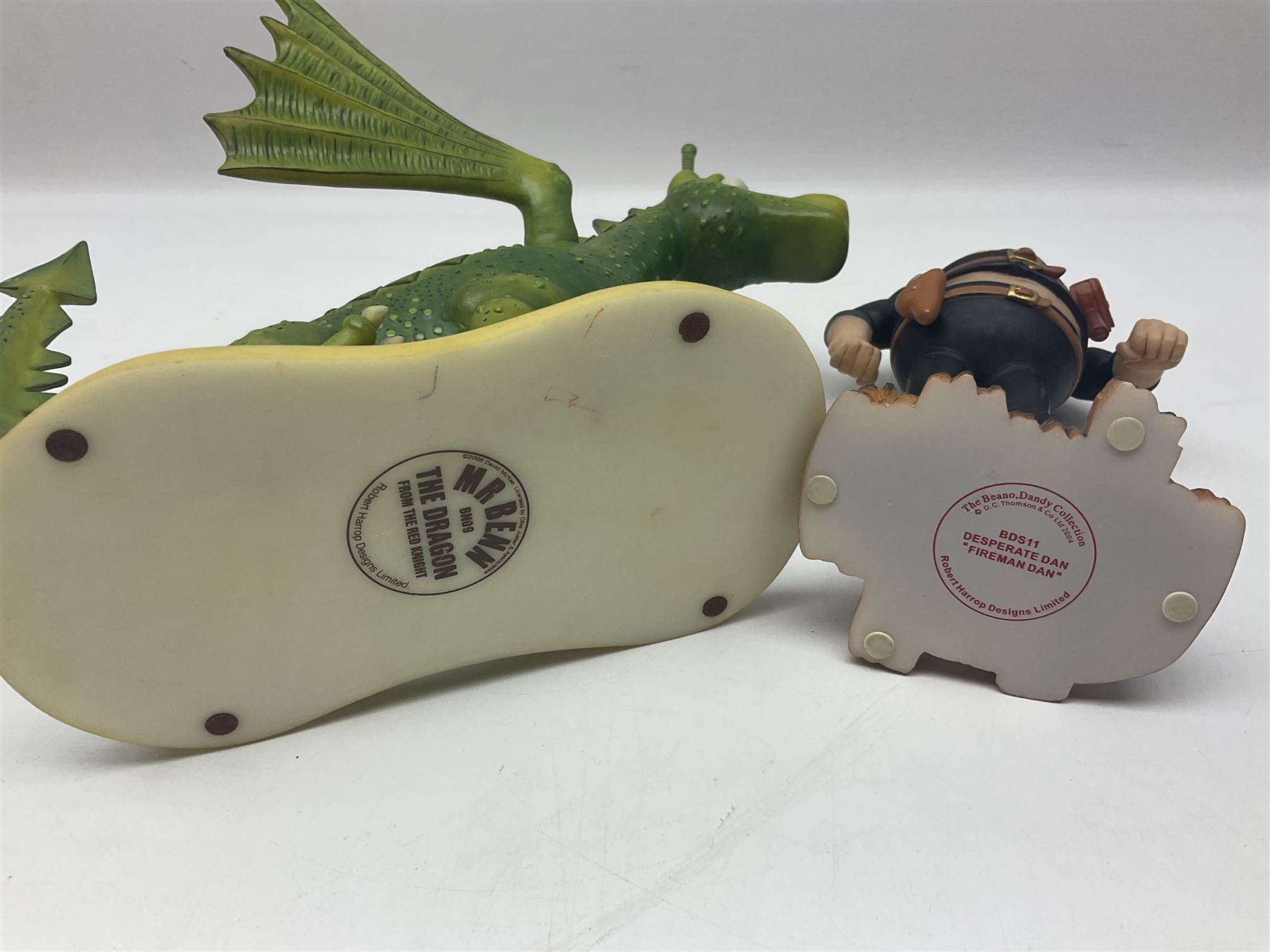 Eleven Robert Harrop figures from various collections, comprising limited edition The Trumpton Fire Engine Musical Box CGMB8 no. 359/1000, The Dragon from the Red Knight BN09, Bulldog Fireman DP165, Pointer Fire Chief DP184, Dalmatian New York Fire Fighter DP234, Dalmatian Fire Fighter DP191; Desperate Dan ‘Fireman Dan’ BDS11, Cuthbert CG13, Pugh (Clarinet) CG70, The Soup Dragon CL05 and Baby Dragon CL06