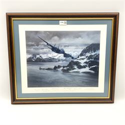 After Michael Turner, colour print 'Find the Tirpitz' depicting a PR Mosquito flying low down a wintry Tromso fjord in 1942 searching for the German battleship Tirpitz, signed on the mount by the artist and six other members of various named squadrons 37 x 41cm, mahogany stained frame